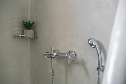 a shower with a shower head in a bathroom at Blue Soul Luxury Villa in Éxo Goniá