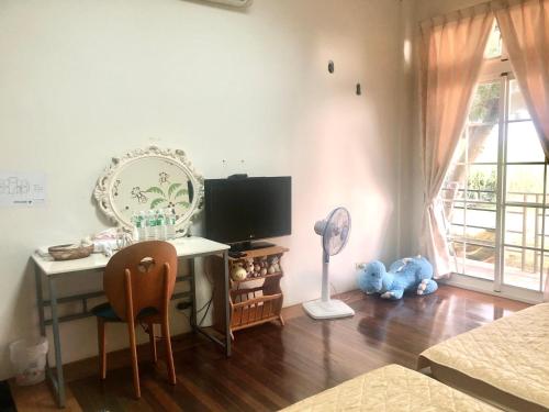 TV a/nebo společenská místnost v ubytování Yuan Fang Homestay