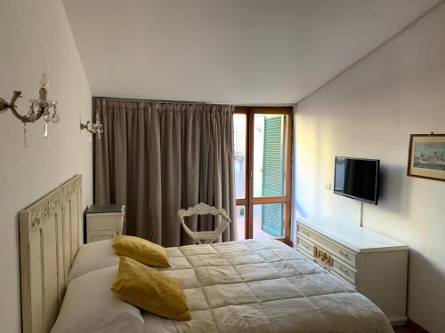 Cama o camas de una habitación en Affittacamere Arco Polinori