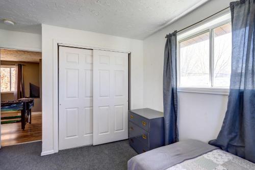 a bedroom with a white door and a window at Charming Montrose Family Home Block to Downtown! in Montrose