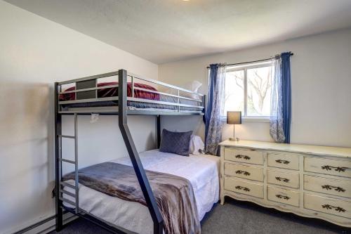 a bedroom with two bunk beds and a dresser at Charming Montrose Family Home Block to Downtown! in Montrose