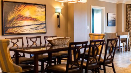 a dining room with a table and chairs at Holiday Inn Club Vacations South Beach Resort in Myrtle Beach