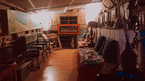 a room with a bunch of chairs in a store at Hospedaje Rural El Rancho de Amelia y Juancho in Silvania