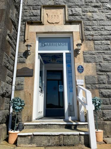a door of a building with a sign above it at Barriemore Oban in Oban