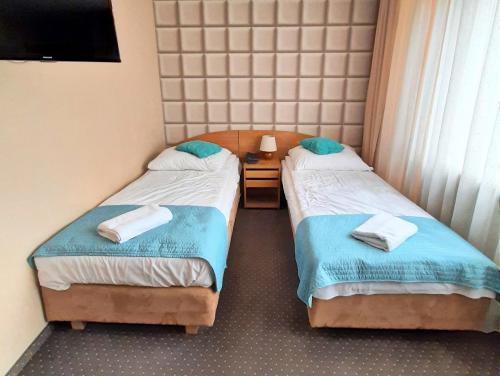 Een bed of bedden in een kamer bij RB Rooms&Apartments