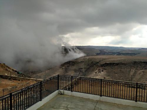 a view from the top of the canyon in the clouds at Vastu Dead Sea apartment in Arad