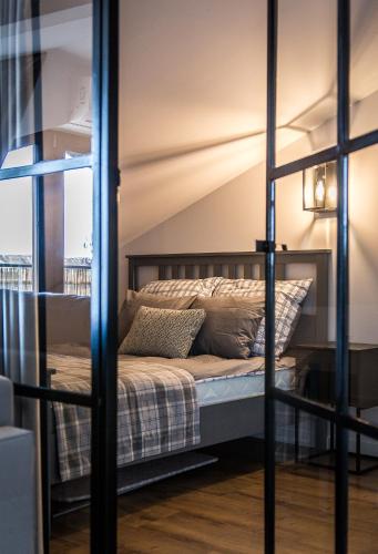 a bedroom with a bunk bed in a room at Apartamenty W37 in Nowy Targ