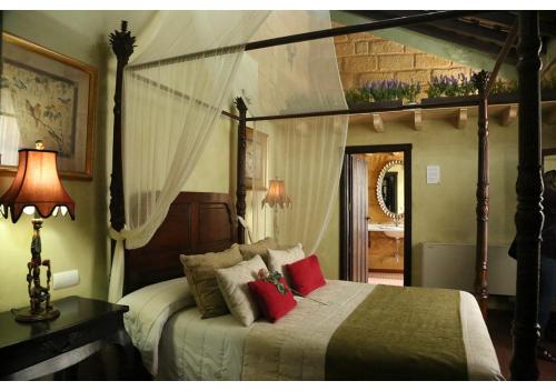 Posteľ alebo postele v izbe v ubytovaní La Casona de Calderón Gastronomic & Boutique Hotel