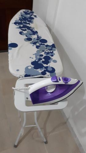 a purple and white chair sitting on a table at Le refuge privatif de Julie in Basse-Pointe