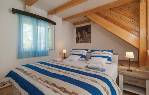 Giường trong phòng chung tại Holiday home Glavica