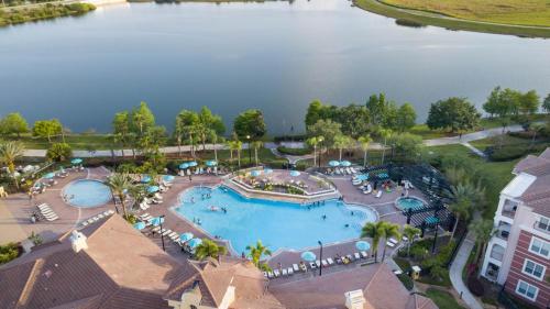 an aerial view of a resort with a large swimming pool at DISNEY PARKS- International Dr - Orlando Luxury Condominium- Fully Equipped - 3bed & 2 bath- in Orlando