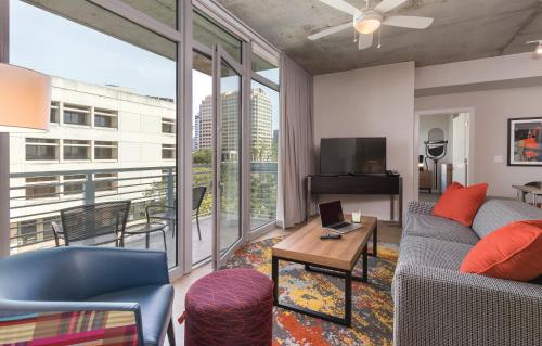 a living room with a couch and a table at Club Wyndham Austin in Austin