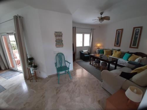 a living room with a couch and a table at Manilva Beach 97 in Manilva