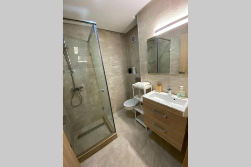 a bathroom with a shower and a sink at Du Haut Standing au coeur du Parc et Plage à 180 m in Mohammedia