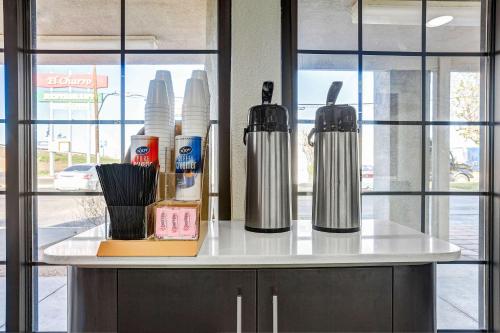 a counter with two kettles on top of it at Motel 6-Amarillo, TX - Airport in Amarillo
