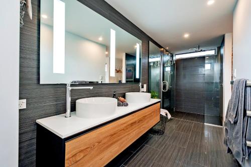 a bathroom with two sinks and a shower at Farm Retreat B&B in West Melton