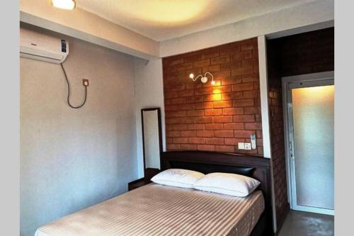 Säng eller sängar i ett rum på Panadura Top view - ACCEDE Apartment