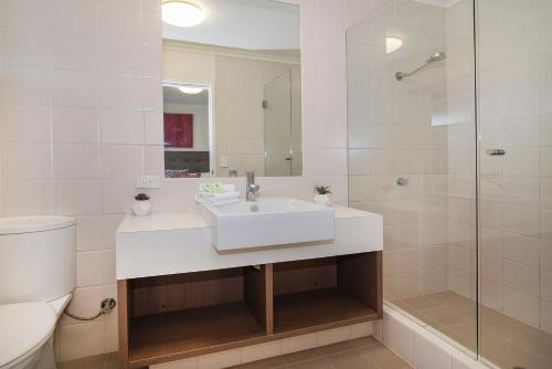 a bathroom with a sink and a toilet and a shower at Apartment 36 in Margaret River Town