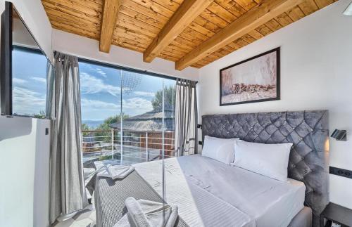 a bedroom with a bed and a balcony at Golden Haven in Murter