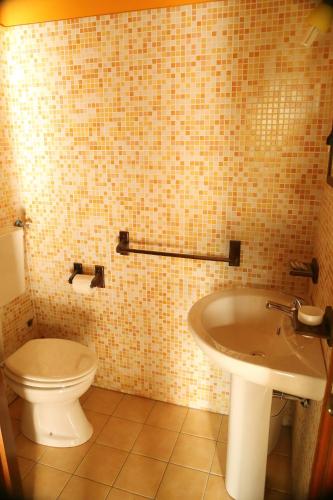 a bathroom with a toilet and a sink at Al Grande Gelso in Cariati
