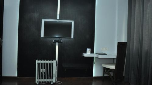 TV a/nebo společenská místnost v ubytování Hotel JSR Continental