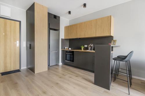 Кухня или мини-кухня в ApartHouse Fabryczna
