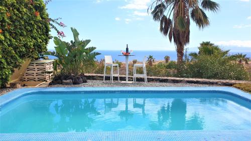 a swimming pool with a view of the ocean at Exclusive Villa Golf Private Pool in Adeje