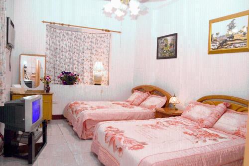 Postel nebo postele na pokoji v ubytování Yilan Xiang Feng Homestay