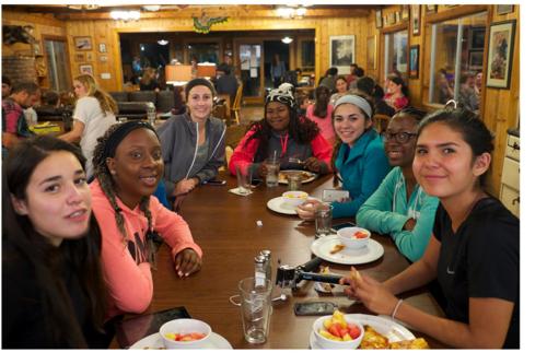 a group of women sitting at a table in a restaurant at Yosemite Bug Rustic Mountain Resort in Midpines