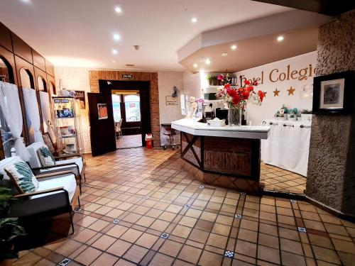 a lobby of a store with a sink and a counter at Hotel Colegiata in Santillana del Mar