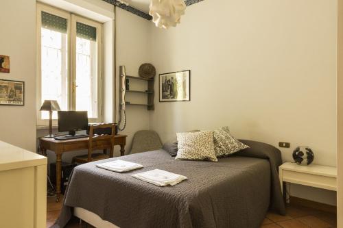 Posteľ alebo postele v izbe v ubytovaní Lemon Tree Apartment Sistine Chapel