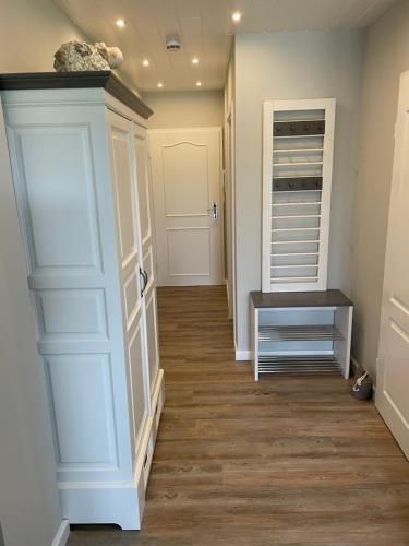 a hallway with a walk in closet and a door at Strandnest in Wyk auf Föhr