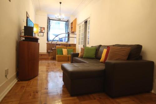 a living room with a couch and a table at Nautic M1 R2 - Classy & Cozy Double Room with Shared Bathroom in Marques Pombal in Lisbon