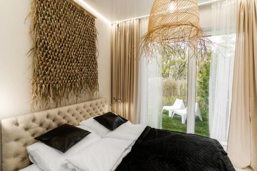 Katil atau katil-katil dalam bilik di Apartament Black