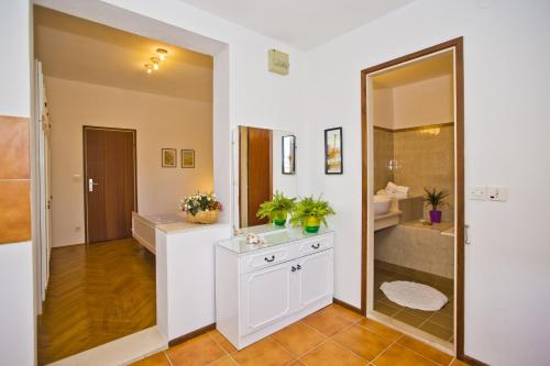 a bathroom with a sink and a mirror at Castle Štambuk in Hvar