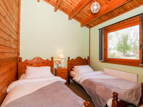 Cama o camas de una habitación en Bittern Lodge