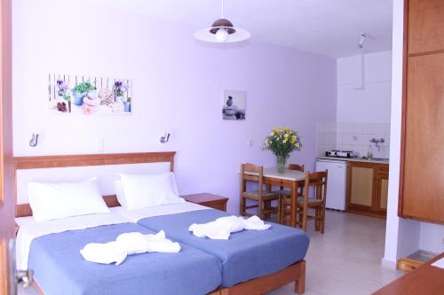 a bedroom with two towels on a bed at Michael Apartments in Rethymno