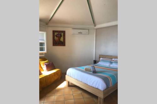 Postel nebo postele na pokoji v ubytování Le Morne Charlotte