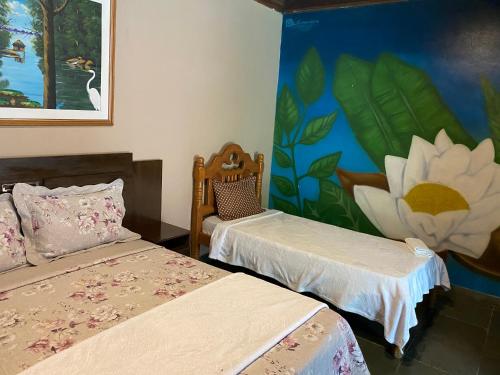 Кровать или кровати в номере Jungle Spa e Hotel