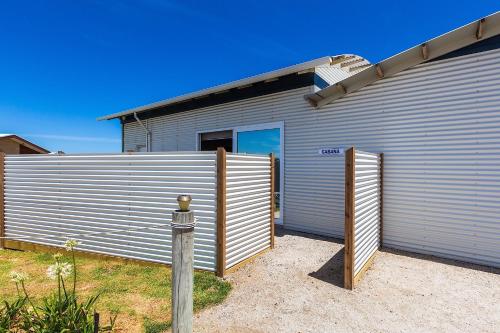 a large metal building with a large garage at Cottages for Couples in Port Fairy