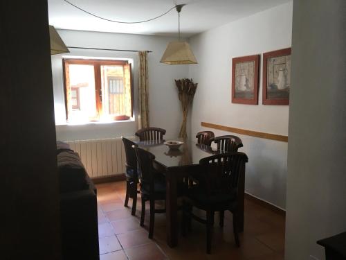 a dining room with a table and chairs at Casa Clemente I in La Hiruela