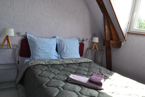 Krevet ili kreveti u jedinici u okviru objekta Chambres d'Hôtes Farcy "La P'tite Transhumance"