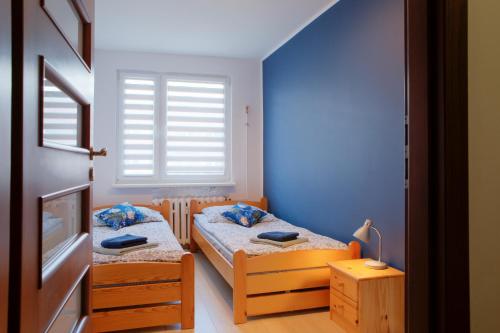 Posteľ alebo postele v izbe v ubytovaní May Land Apartment