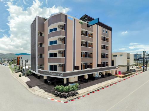 a rendering of a building on the side of a street at Corner One Residence in Hat Yai