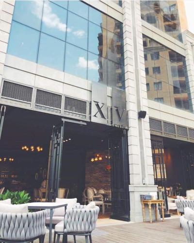 a building with chairs and tables in front of it at City Central Apartment in Yerevan