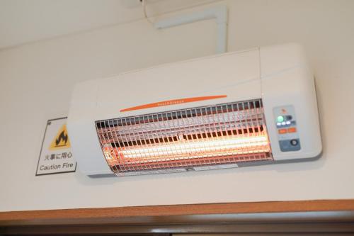 a microwave oven sitting on top of a counter at Mon Petit Chat in Kanazawa