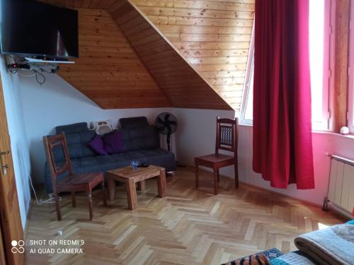 a living room with a couch and a table at Balaton Holiday in Fonyód