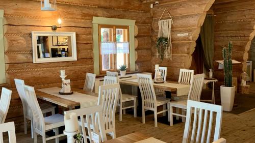 a dining room with a table and chairs at Jaszowianka Best For You in Ustroń
