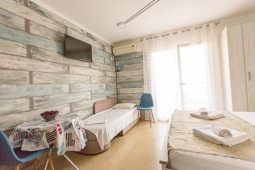 Apartments Alesia Bečići tesisinde bir odada yatak veya yataklar