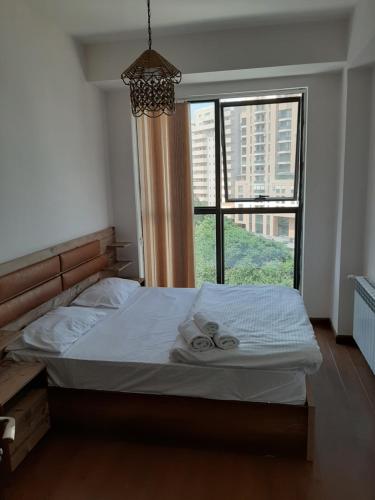 Кровать или кровати в номере City Central Apartment